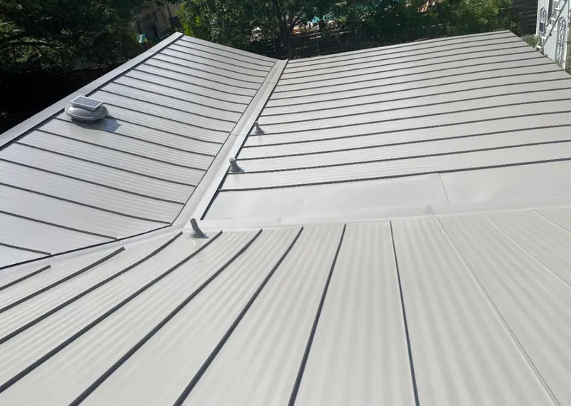 Solar attic fan installed on a metal roof for Roof Ventilation in Kapolei
